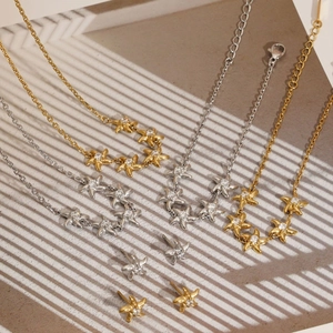 Parure de bijoux étoile de mer dorée et argentée avec collier et boucles d'oreilles