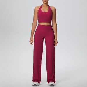 Detail of berry red halter neck sports bra and high-waist wide-leg yoga pants set