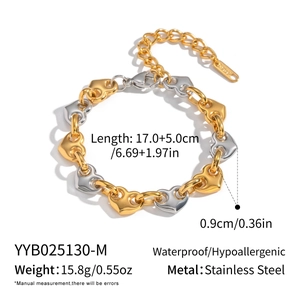 Detail view of gold and silver stainless steel heart chain bracelet with dimensions