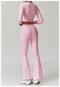 Rear view of slim fit yoga set featuring pink long sleeve top and flared leggings