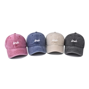 Washed vintage cotton baseball caps with embroidered bruh text in four assorted colors