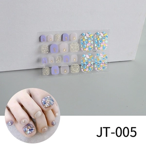 Macro detail of JT-005 toe nail stickers with purple glitter and shell textures