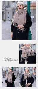 Macro detail of soft light brown fringed scarf texture on urban city background