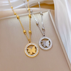 Titanium steel butterfly necklace in gold and silver finish with crystal ring pendant