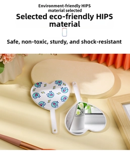 Detail of heart-shaped handheld mirror featuring eco-friendly HIPS material and cartoon pattern