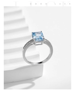 Detailed macro view of S925 sterling silver ring with blue square-cut zircon and side stones