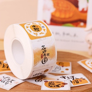 Macro detail of Chinese Moon Festival rabbit stickers for mooncake gift packaging