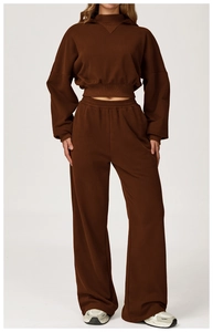 Detail of dark brown heavy cotton hooded sweatshirt and wide-leg jogger set fabric