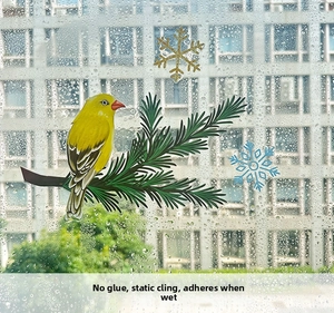 Detail of bird and snowflake static window sticker showing water-activated glue-free cling