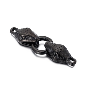 Detail of black stainless steel double snake head clasp with intricate scale texture