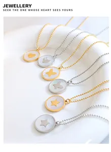 Macro detail of titanium steel necklace pendants with heart, butterfly and star designs