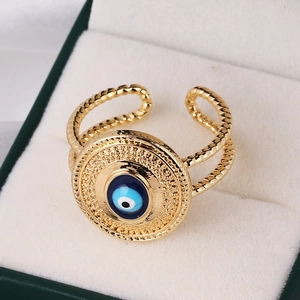Macro detail of vintage golden evil eye ring displayed in premium velvet jewelry box