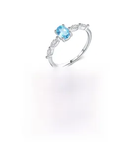 Close-up of S925 sterling silver ring with oval blue crystal and marquise side stones