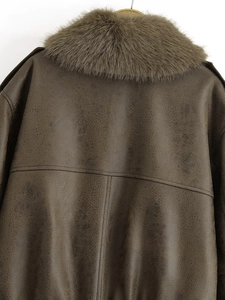Detail view of the brown leather bomber jacket with detachable faux fur collar on back