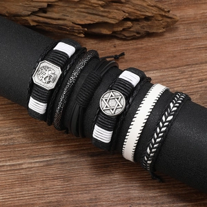 Men's punk leather braided bracelet set with skull and star charms on a display stand