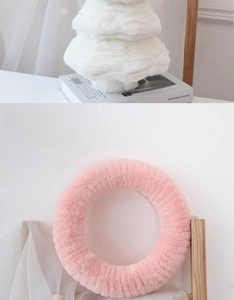 Detailed view of pink plush wreath and white layered wool felt tree desktop decoration