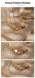 Macro detail of minimalist round disc necklace in polished gold and silver finish