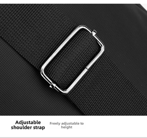 Adjustable black nylon shoulder strap with a silver metal buckle for custom length