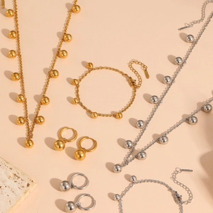 Chic stainless steel jewelry set with sphere pendants in gold and silver finish