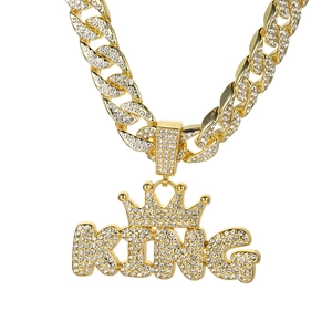 Gold plated iced out King crown pendant with thick Cuban link chain necklace