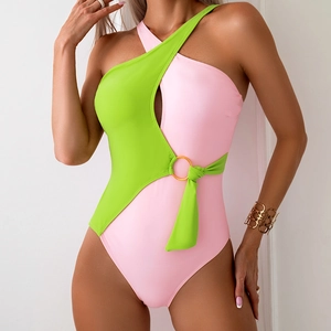 Pink and neon green color-block one-piece swimsuit with asymmetrical cut and gold ring