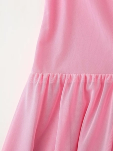 Close-up detail of pink mesh fabric showing fine texture and gathered pleated waistline