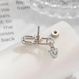 Star safety pin earring with a heart-shaped blue zircon pendant in silver metal