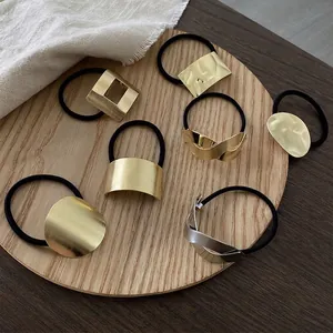 Set of 7 minimalist brushed metal hair ties with gold and silver geometric accents