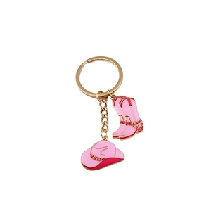 Pink western cowboy hat and boots keychain with gold finish and enamel details
