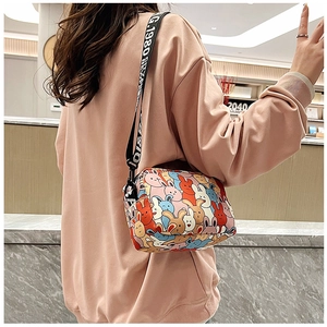 Detail of cute rabbit print messenger bag with adjustable lettered crossbody strap