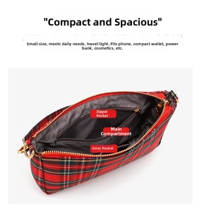 Detailed interior of red plaid baguette bag showing zipper and slip pockets