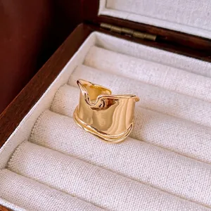 Minimalist wide irregular gold open ring with polished liquid metal texture