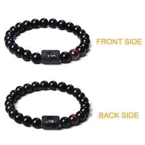 Front and back view of obsidian stone bead bracelet with tiger eye and zodiac charm