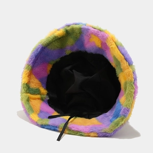 Detail of colorful faux fur bucket hat showing inner black lining and adjustable drawstring