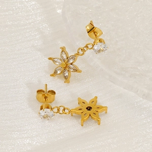 Gold plated starburst earrings with sparkling zircon crystals in a floral design