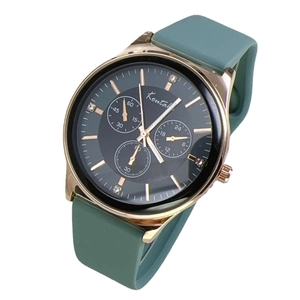Sporty quartz watch with green silicone strap and gold case featuring a chronograph dial