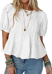 Close-up of white puff sleeve blouse with tiered pleated hem and round neckline