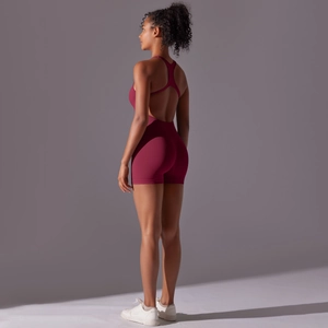 Detailed back view of a burgundy backless yoga jumpsuit with high elasticity