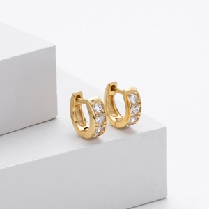 Elegant s925 gold earrings with three sparkling zircons on modern geometric podium