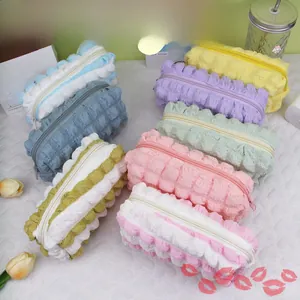 Macro shot of 3D bubble textured fabric and smooth zipper detail on large pencil case