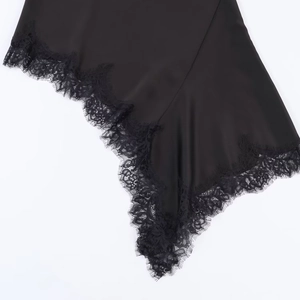 Chic black satin dress featuring delicate lace trim and asymmetric hemline design