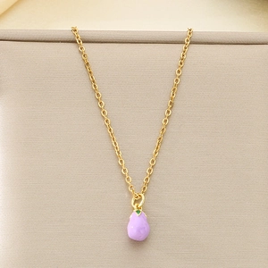 Detailed view of creative mini purple eggplant pendant on a delicate golden chain