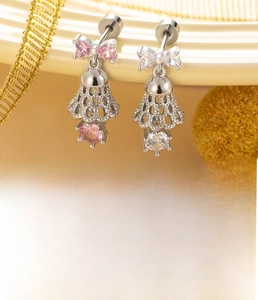 Detail view of silver bow bell stud earring with pink zircon and 0.8x6mm titanium steel post