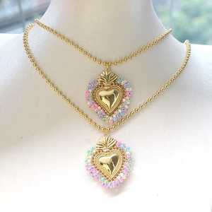 Golden beaded chain necklace set with heart pendant featuring colorful seed beads