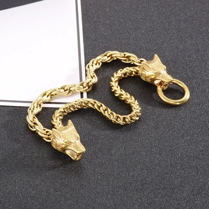 Mens double wolf head bracelet in gold finish with thick metal curb chain link