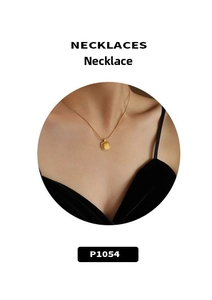 Detail showing a square gold plated pendant necklace with brushed texture on Asian model