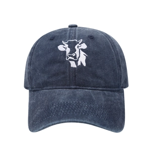 Close-up of high-quality white cow head embroidery on washed cotton baseball cap