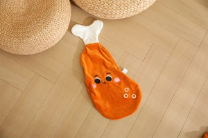 Detail of creative chicken drumstick plush cushion with cute cartoon eyes and soft fabric