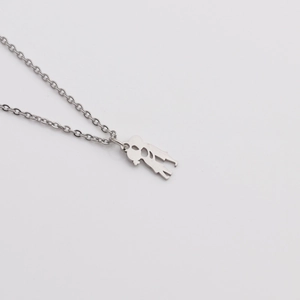 Detail of silver titanium steel O-chain necklace with boy and girl heart silhouette pendant