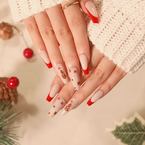 Christmas coffin nails with ginger man and red french tips in festive almond shape